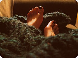 woman feet with blanket
