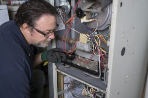 Furnace home inspection by Aire One technician.