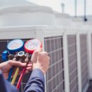Technician is checking air conditioner ,measuring equipment for filling air conditioners.