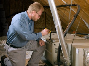 Man working on cleaning furnace