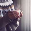 Woman staying warm with furnace heating system