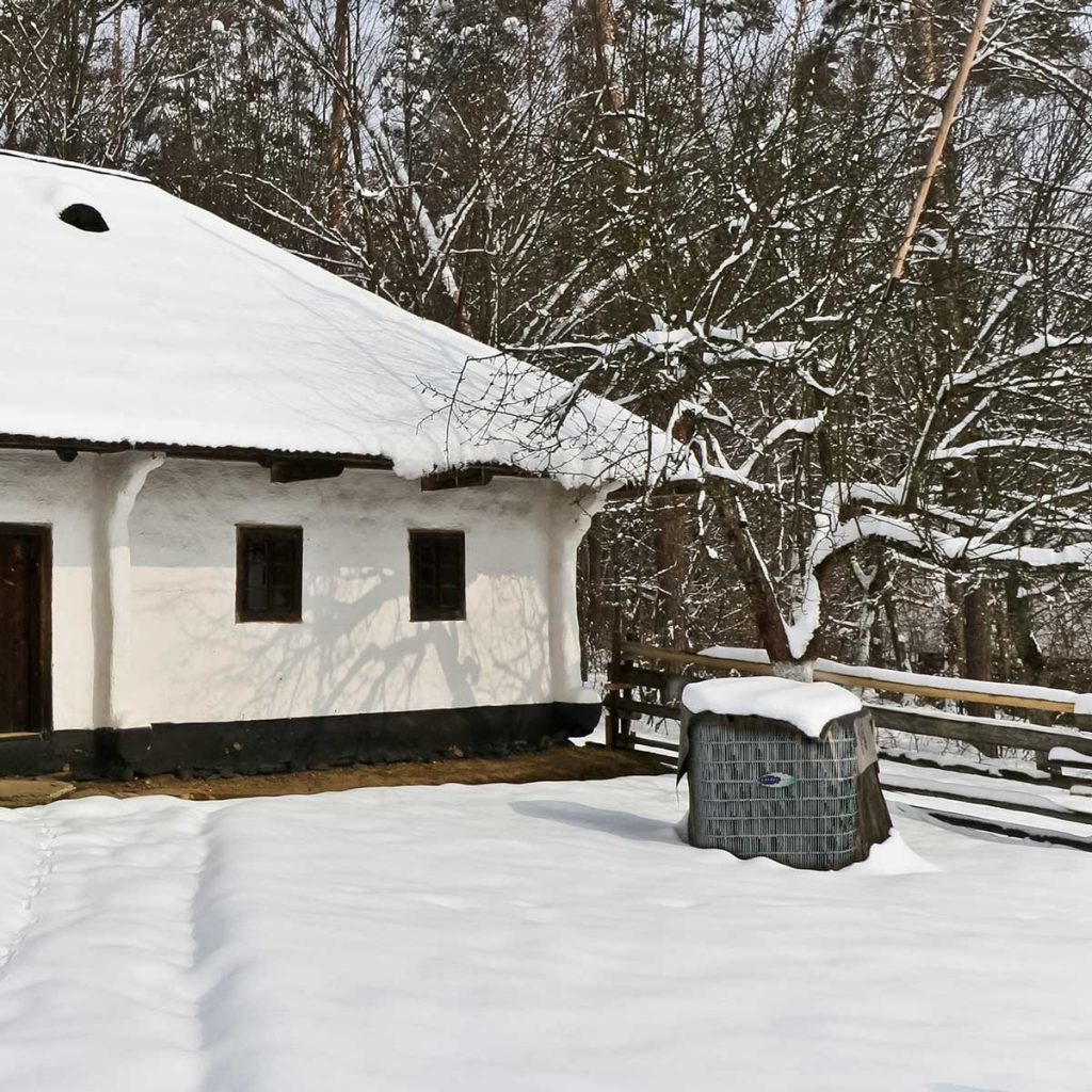 ac covered with snow